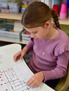 A child working on a short task