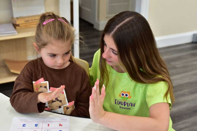 A young child learning with a teacher